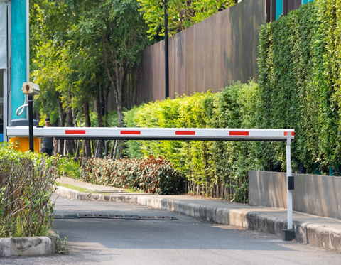 Gate arm and security camera at entrance