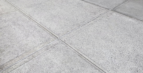 Regular cast-in-place concrete with broom finish and cut or tooled joints